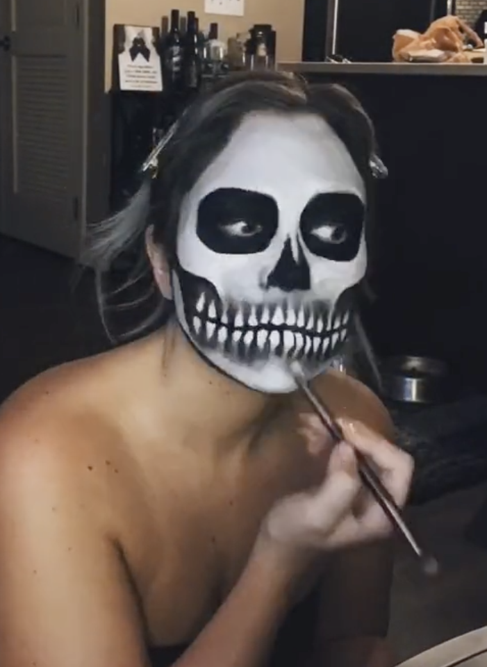 Using white and black eyeshadow to add shading for skull makeup
